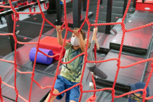 Kid on cargo net